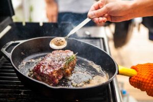 chef cooking steak